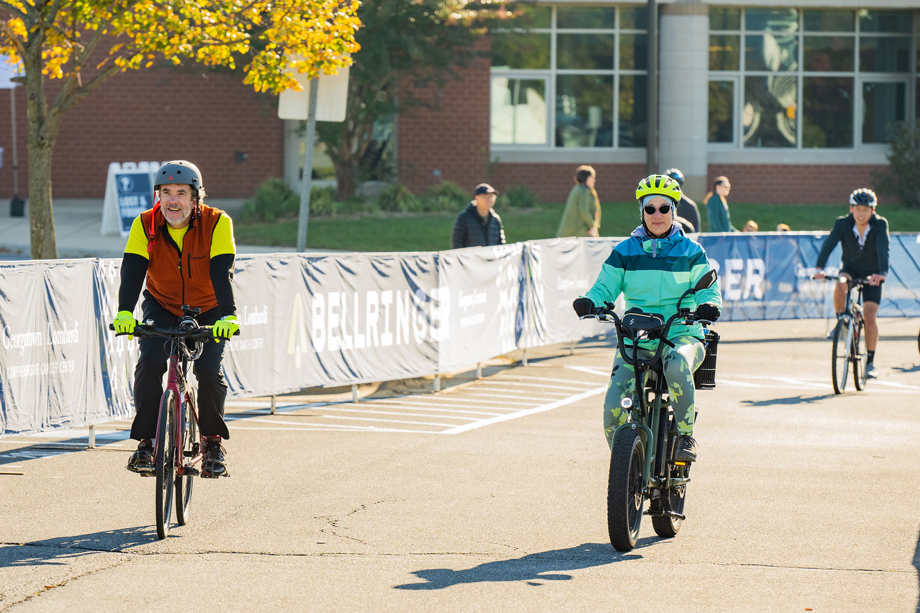 BellRinger riders riding their bikes into the finish line