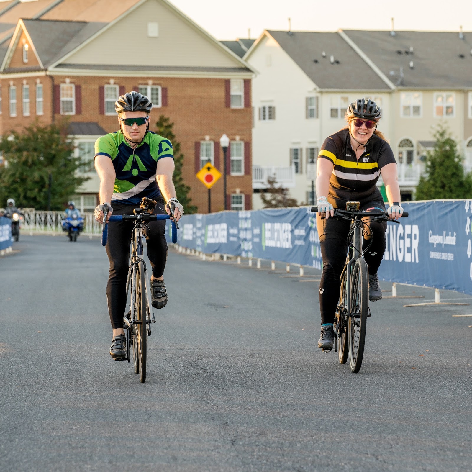 Two BellRinger riders crossing the finish line