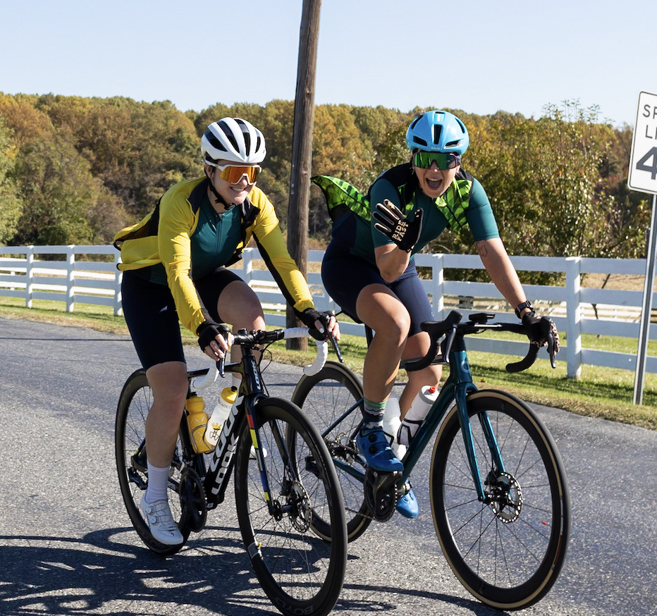 Two BellRinger riders riding their bike and smiling