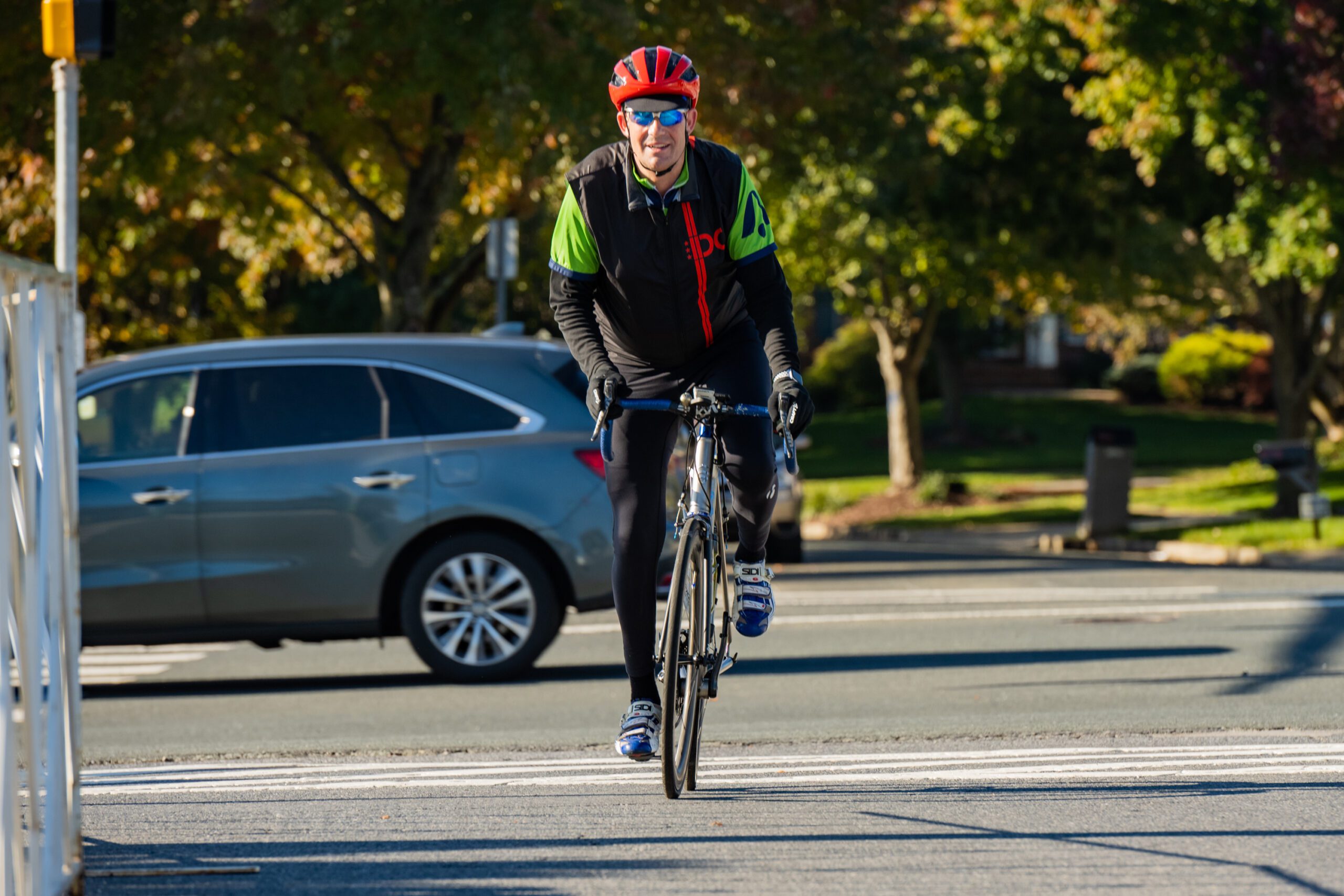 BellRinger rider riding their bike leaving a parking lot