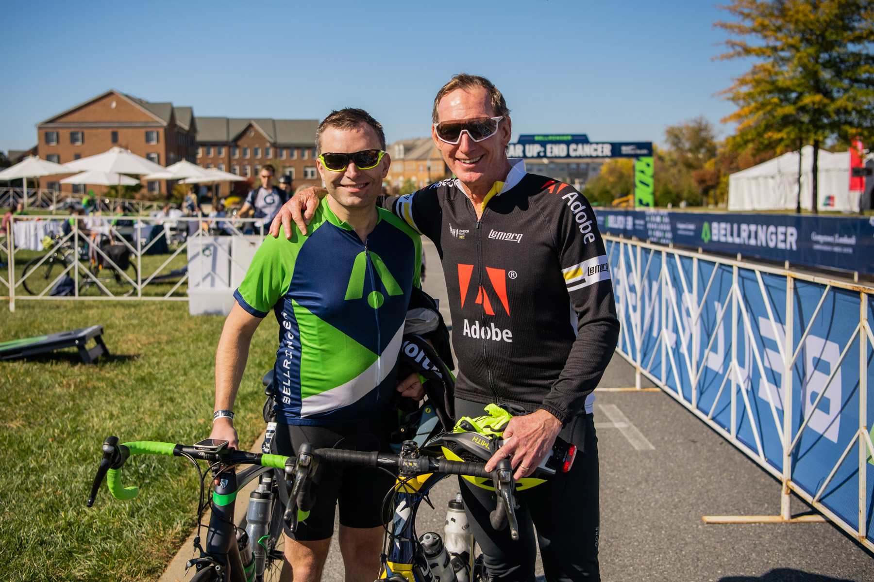 Two BellRinger riders posing with their bikes after finishing the ride