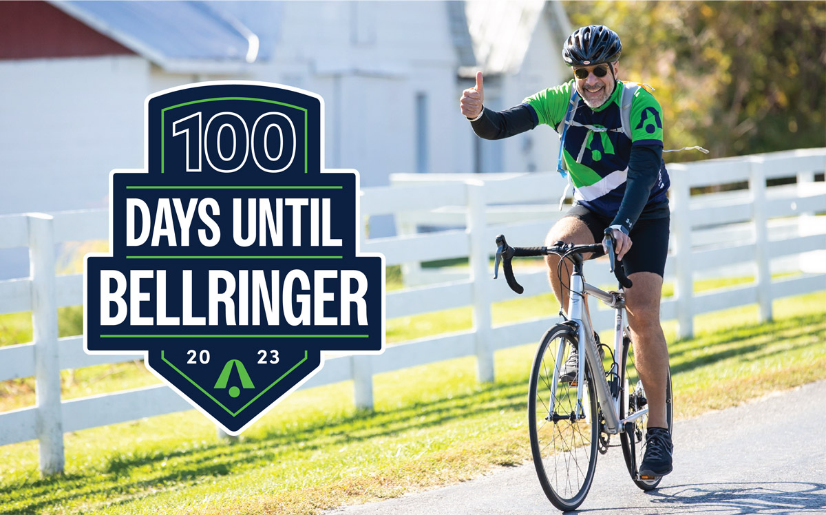 A BellRinger rider on their bike giving a thumbs up next to the 100 days until BellRinger 2023 logo